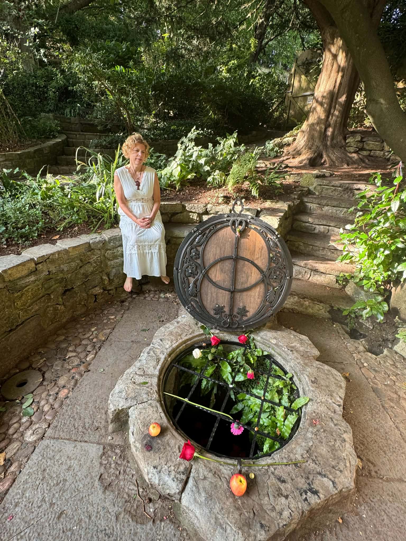 Janet Clifford at a sacred garden well