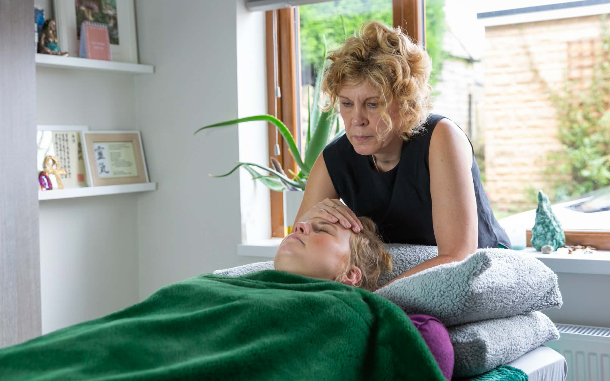 Janet Clifford giving a Reiki session